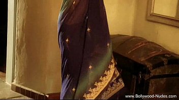 A Seductive Bollywood Beauty Flashes A Sultry, Inviting Smile
