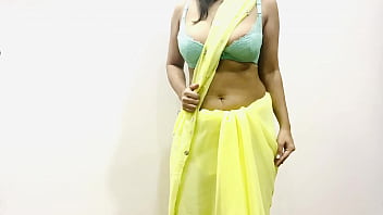 Sultry Indian Bhabhi In Yellow Saree Teases With Her Massive Melons