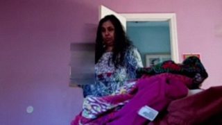 Peeping At A Voluptuous Indian Aunty Undressing In Her Bedroom